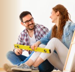 couple with plank of wood